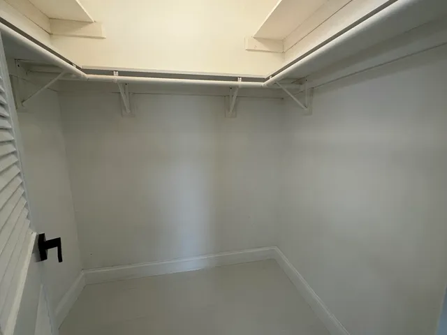 a view of an empty walk in closet