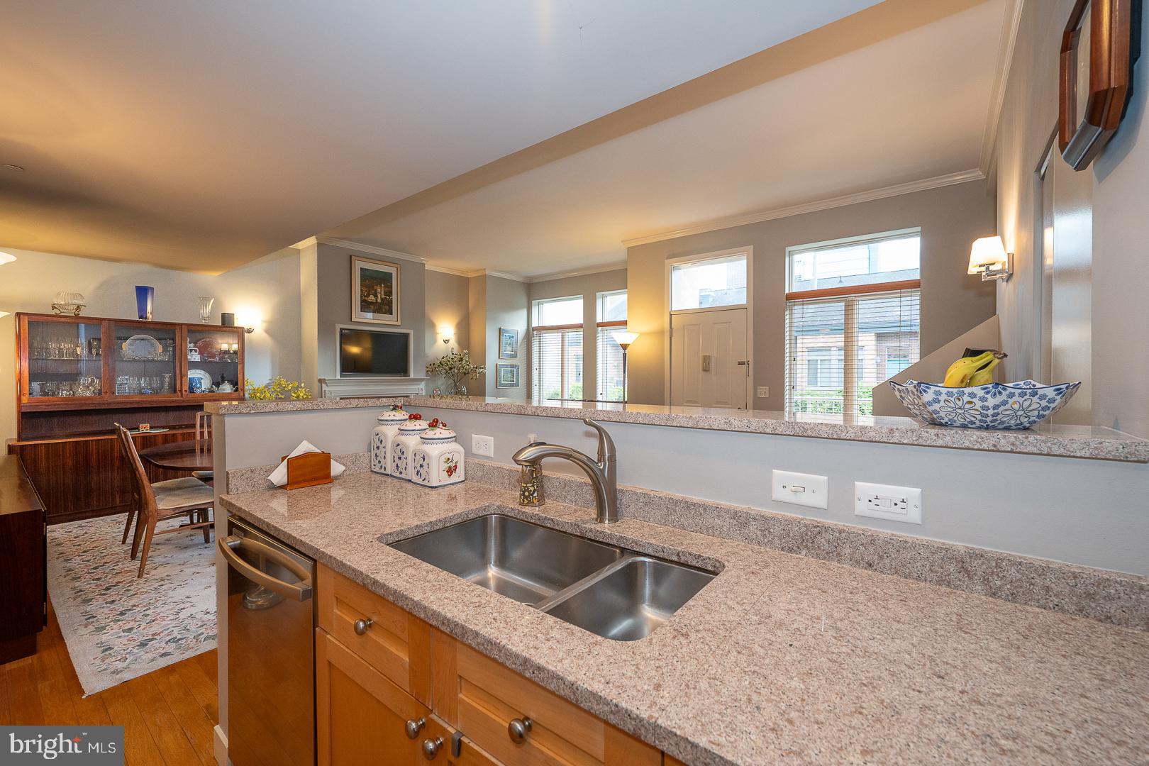 1900 Hamilton Street, Unit D19 Philadelphia, PA 19130 - Photo 11 of 36 a kitchen with stainless steel appliances granite countertop a sink stove and cabinets