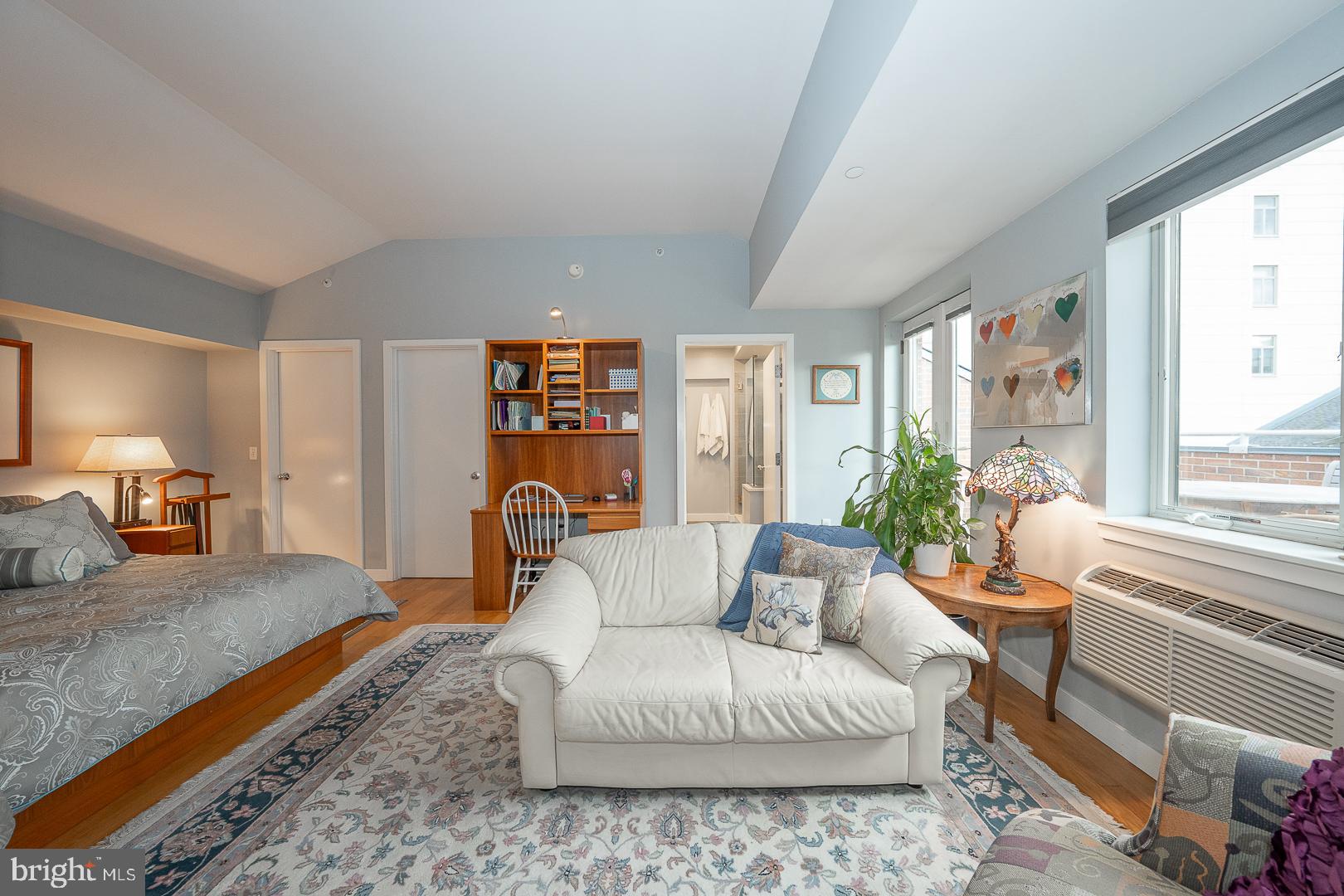 1900 Hamilton Street, Unit D19 Philadelphia, PA 19130 - Photo 14 of 36 a living room with furniture and a large window