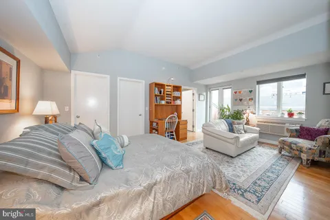 a bedroom with furniture and a couch