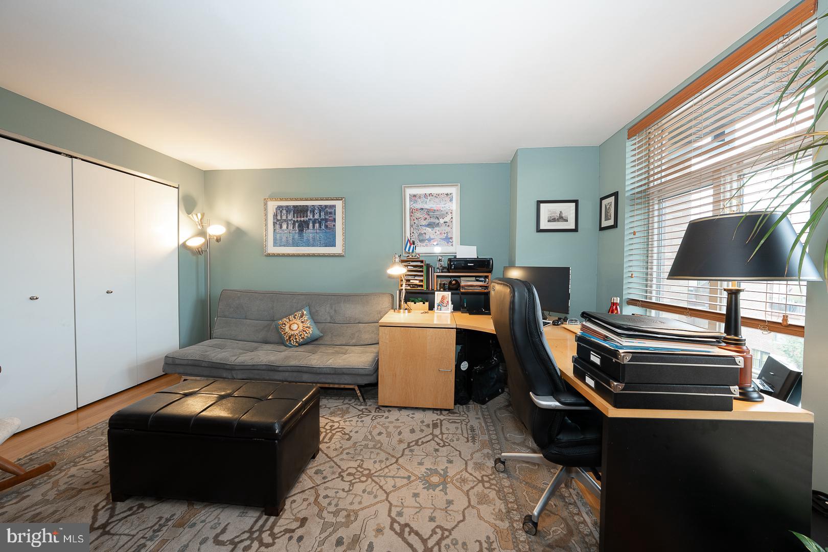 1900 Hamilton Street, Unit D19 Philadelphia, PA 19130 - Photo 24 of 36 a living room with a couch and a flat screen tv