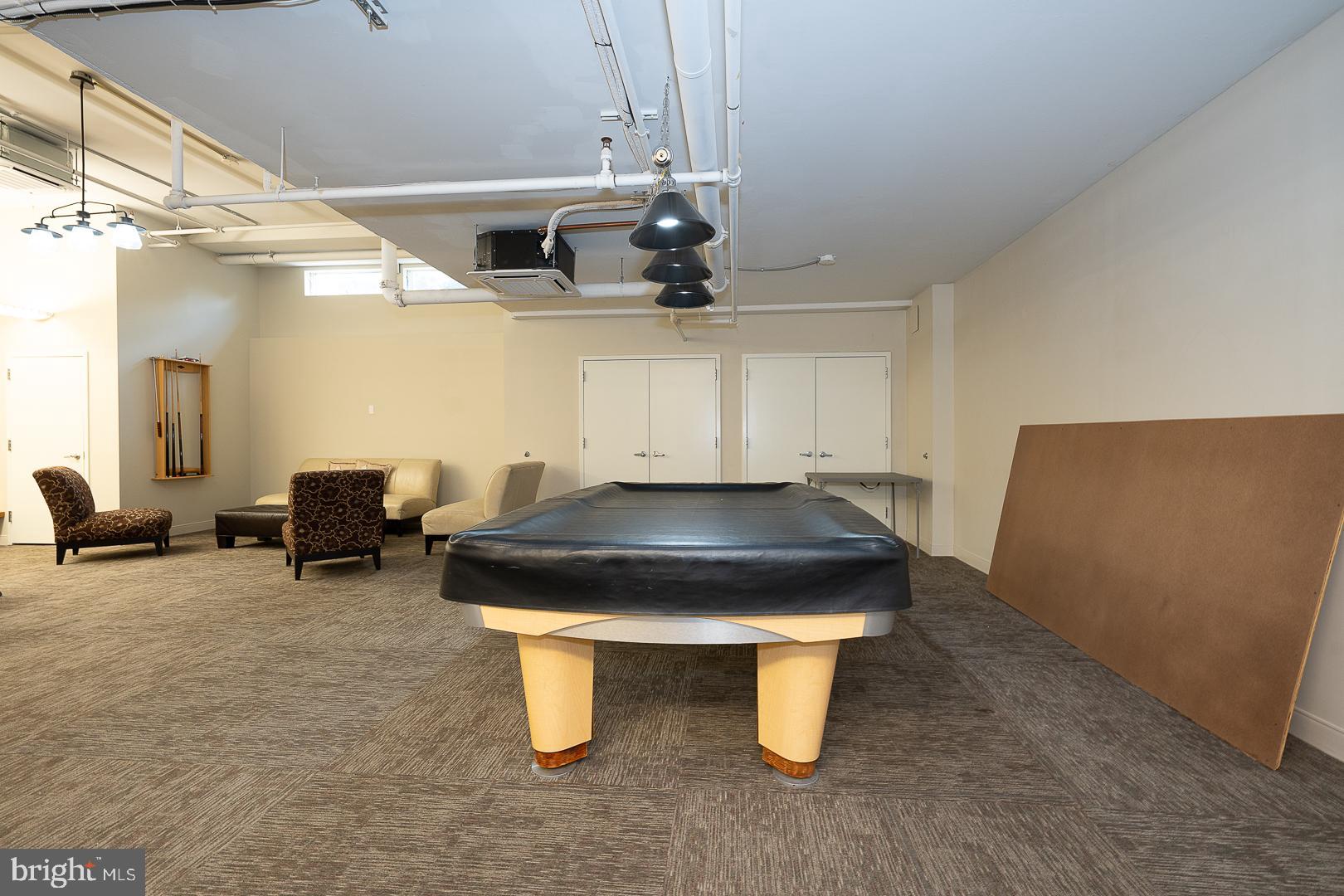 1900 Hamilton Street, Unit D19 Philadelphia, PA 19130 - Photo 31 of 36 a room with pool table and windows