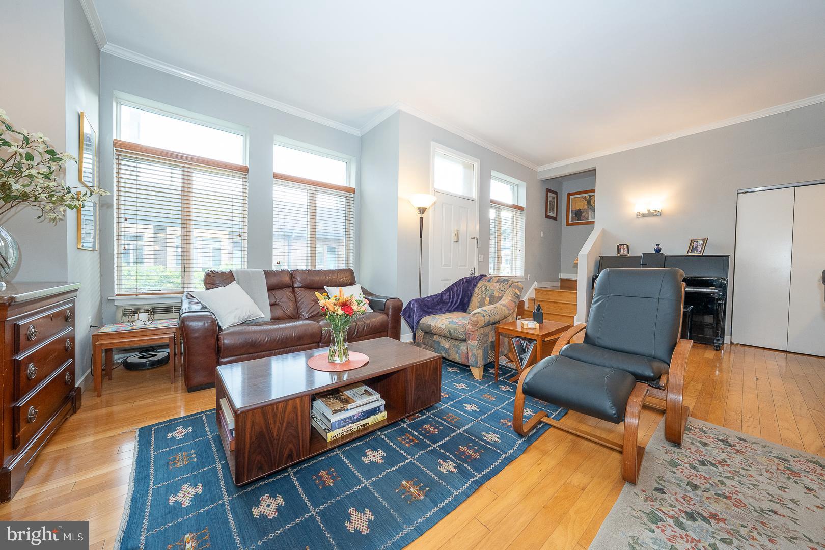1900 Hamilton Street, Unit D19 Philadelphia, PA 19130 - Photo 5 of 36 a living room with furniture fireplace and a table