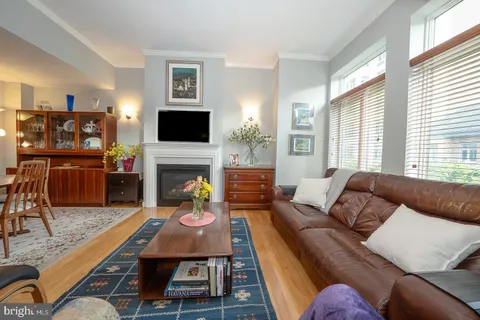 a living room with furniture fireplace and a flat screen tv