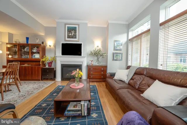 a living room with furniture fireplace and a flat screen tv