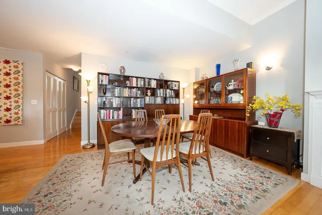 a dining room with furniture and a flat screen tv