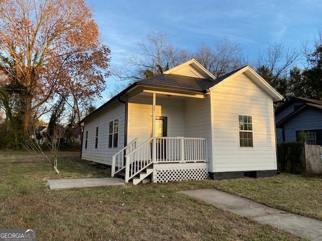 409 Pennington Avenue Southwest Rome, GA 30161 - Photo 1 of 1 a front view of a house with a yard