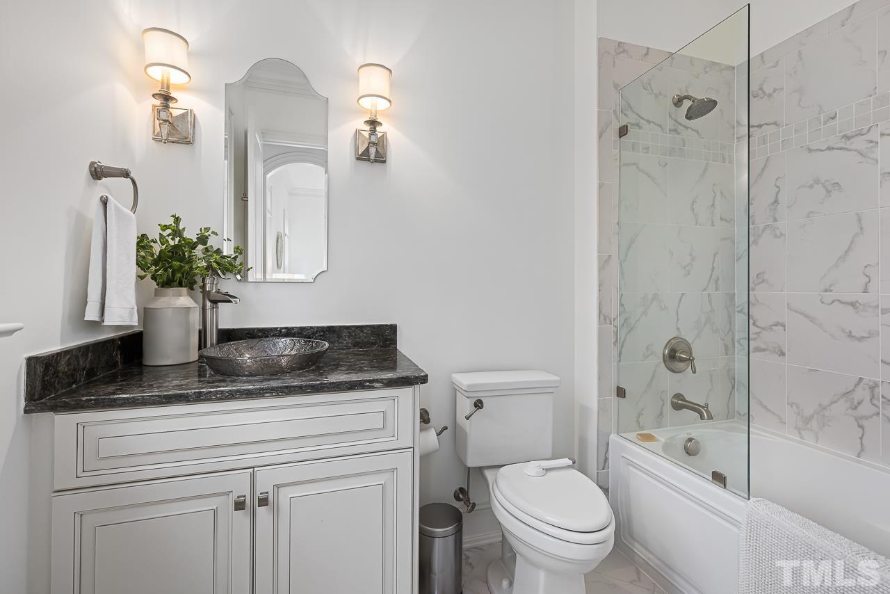 18 Crimson Oak Drive Durham, NC 27713 - Photo 24 of 87 a bathroom with a granite countertop sink a toilet and shower