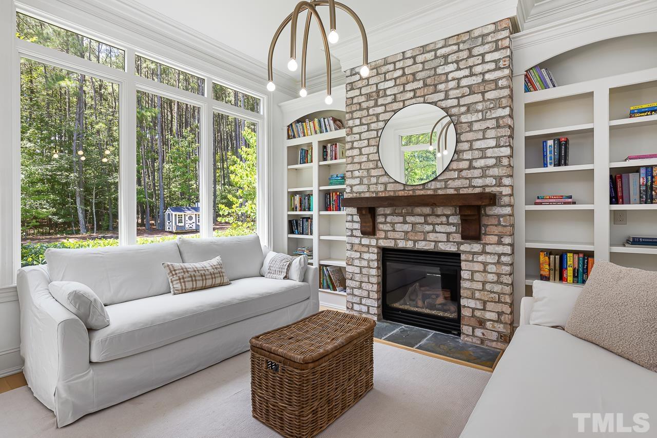 18 Crimson Oak Drive Durham, NC 27713 - Photo 26 of 87 a living room with furniture a fireplace and a large window