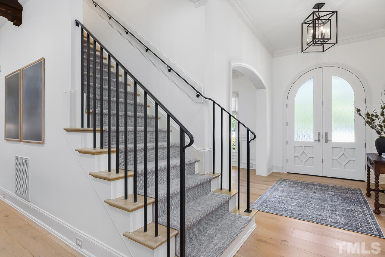 18 Crimson Oak Drive Durham, NC 27713 - Photo 3 of 87 a view of staircase with wooden floor and a rug
