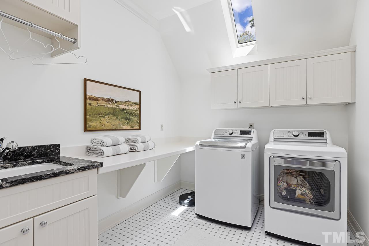 18 Crimson Oak Drive Durham, NC 27713 - Photo 31 of 87 a view of living room with washer and dryer
