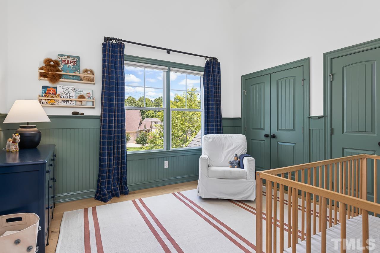 18 Crimson Oak Drive Durham, NC 27713 - Photo 32 of 87 a bedroom with a bed and a large window