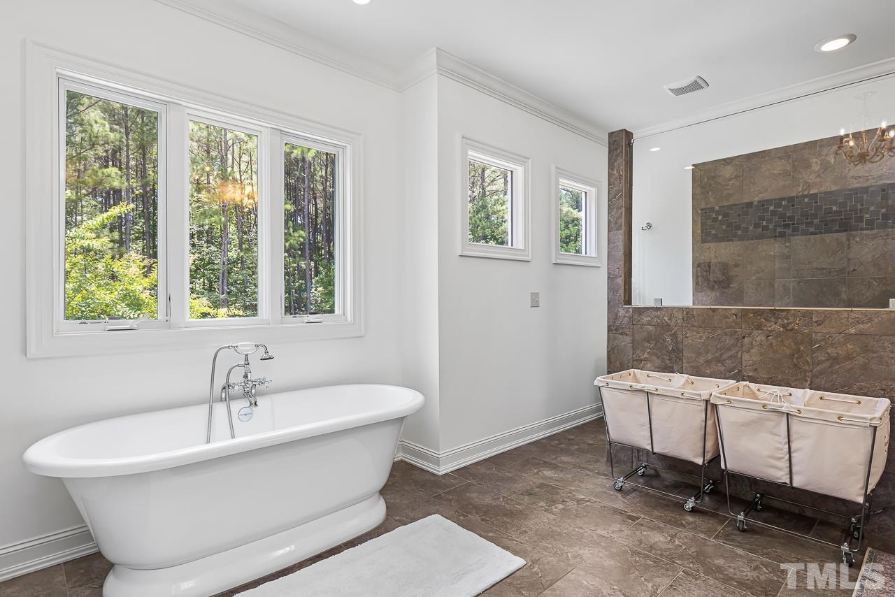 18 Crimson Oak Drive Durham, NC 27713 - Photo 42 of 87 a white bath tub sitting next to a window