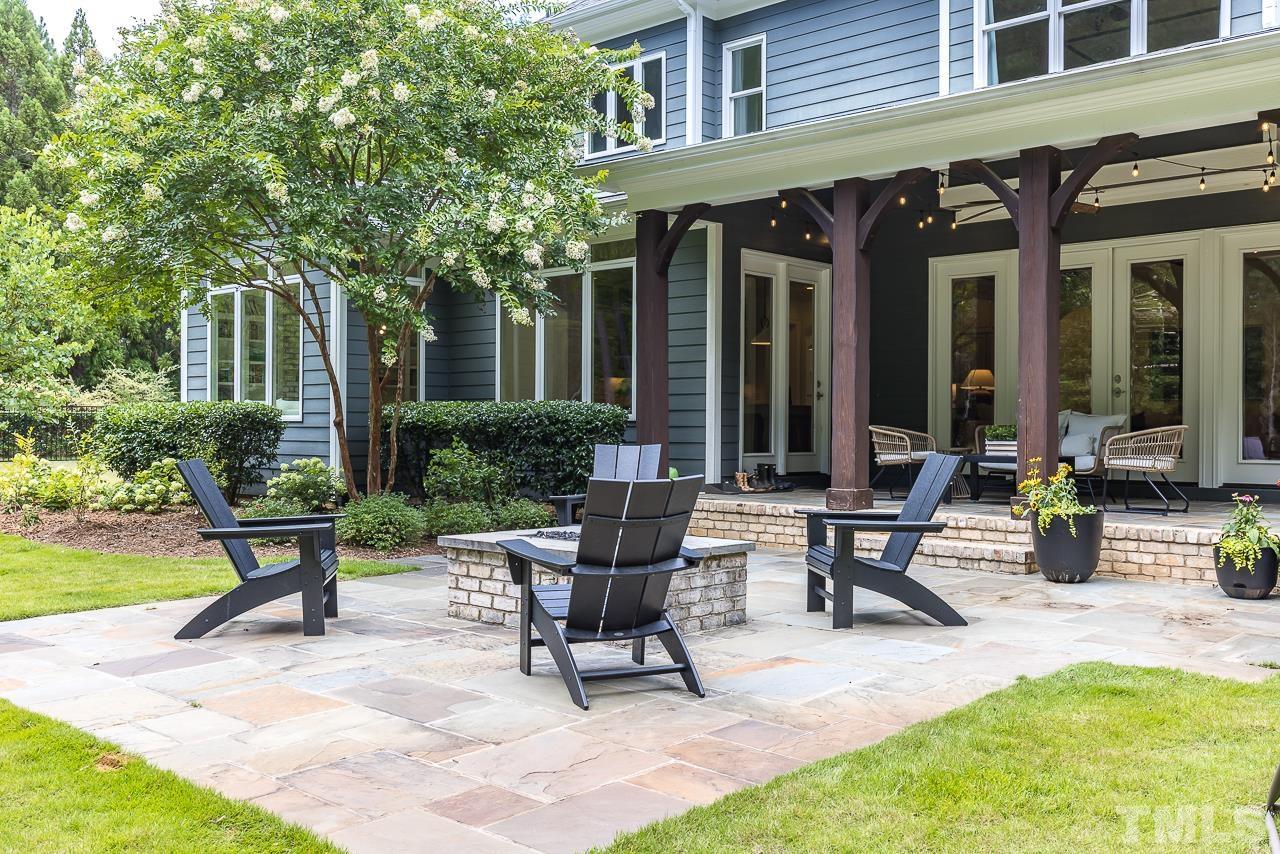 18 Crimson Oak Drive Durham, NC 27713 - Photo 51 of 87 a view of a building with sitting area and garden