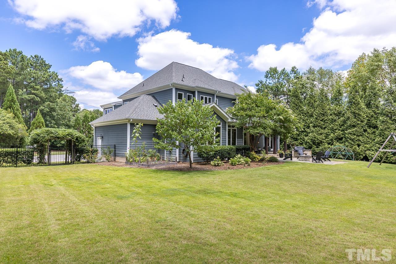 18 Crimson Oak Drive Durham, NC 27713 - Photo 58 of 87 a view of a house with a yard and sitting area