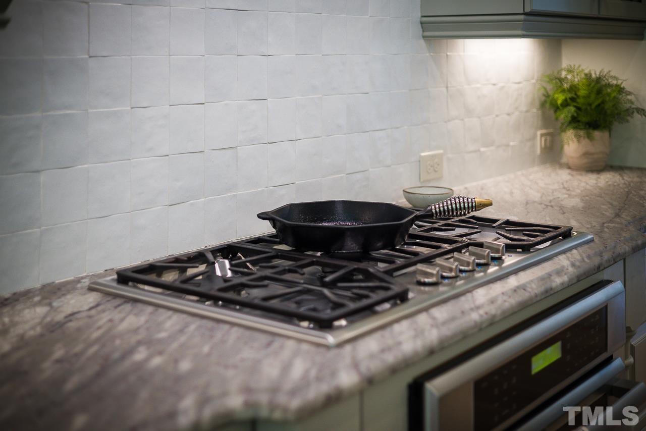 18 Crimson Oak Drive Durham, NC 27713 - Photo 67 of 87 a stove top oven sitting inside of a kitchen