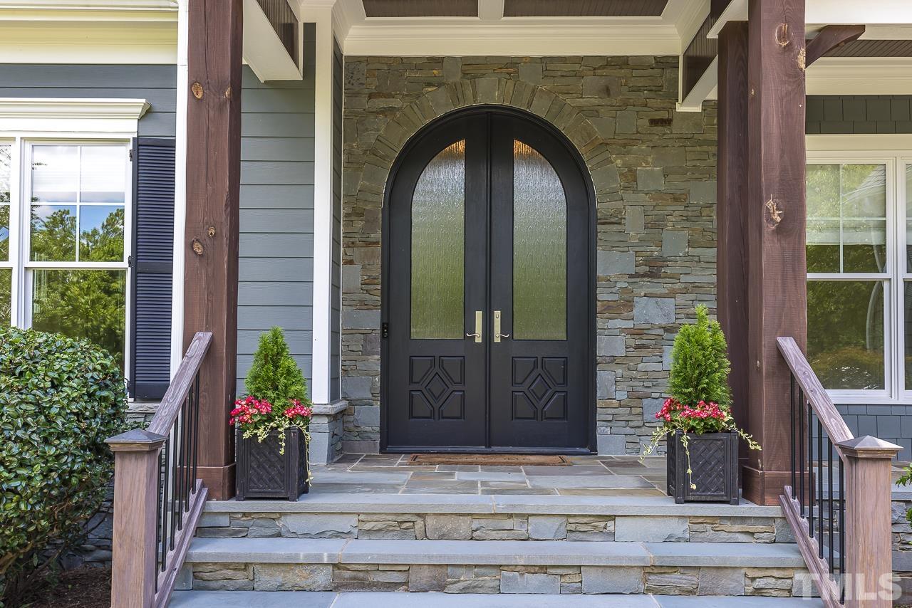 18 Crimson Oak Drive Durham, NC 27713 - Photo 79 of 87 a front view of a house with potted plants