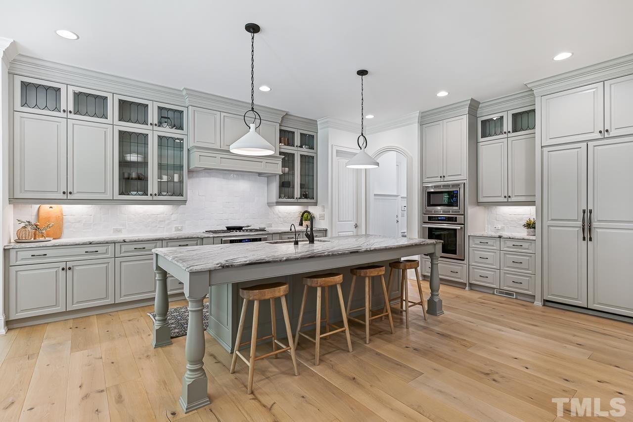 18 Crimson Oak Drive Durham, NC 27713 - Photo 10 of 87 a kitchen with stainless steel appliances granite countertop a kitchen island hardwood floor and a sink