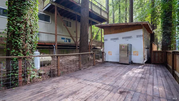 a view of a house with a door and wooden floor