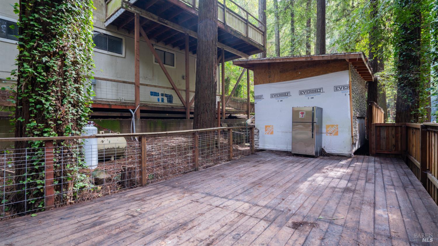 11144 Ice Box Canyon Road Forestville, CA 95436 - Photo 36 of 38 a view of a house with a door and wooden floor