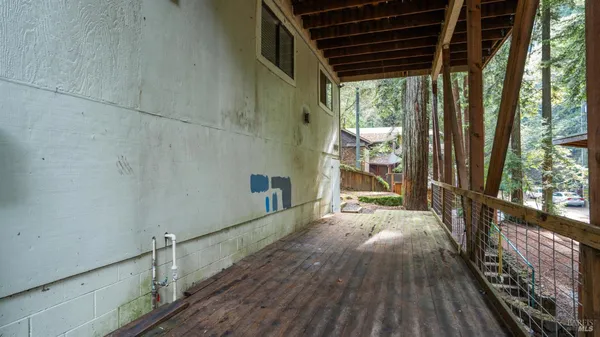 a view of balcony with wooden floor