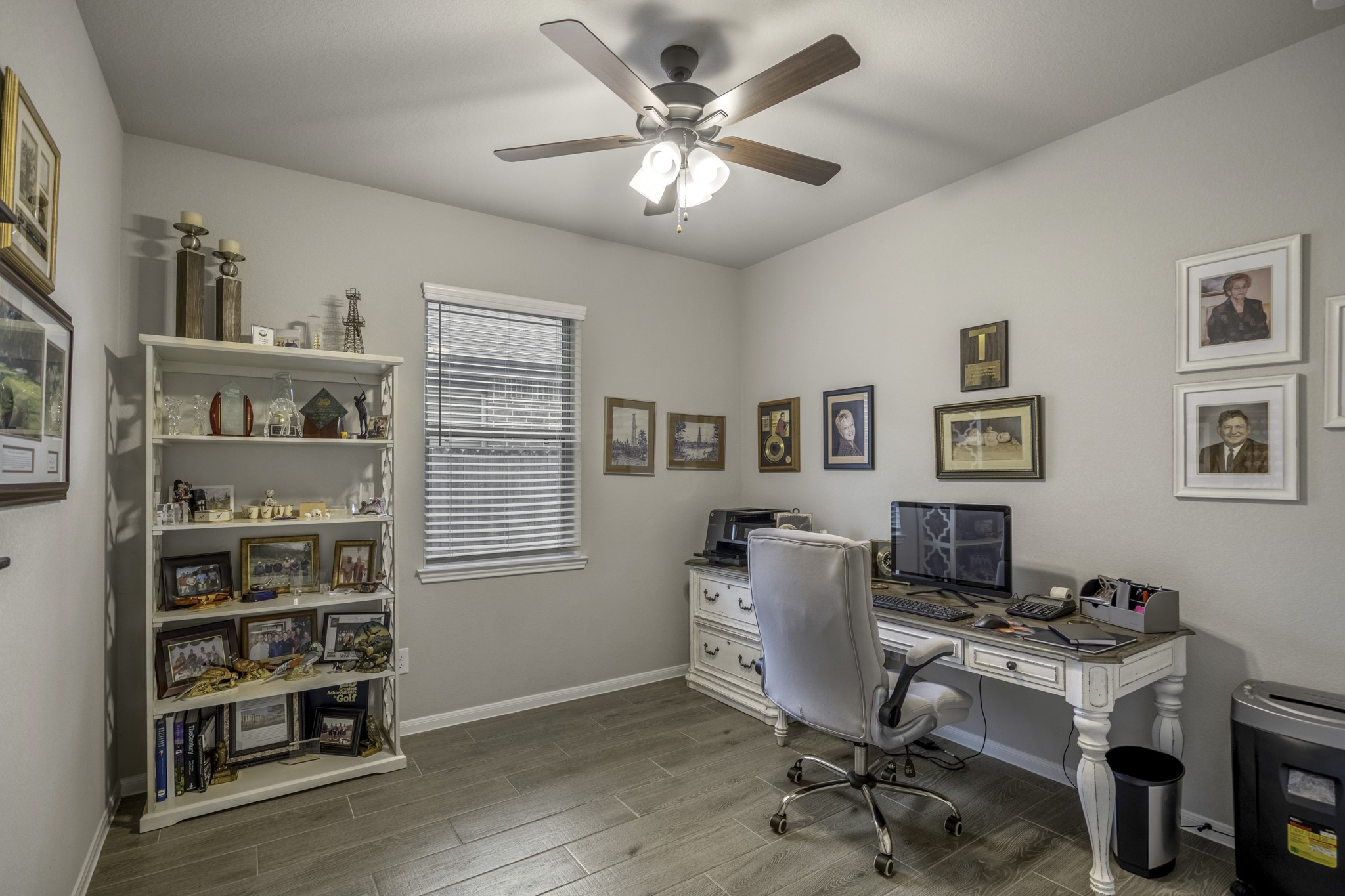 30391 Limber Pines Drive Magnolia, TX 77355 - Photo 11 of 49 This inviting office space is bathed in natural light from a generous window and features a stylish fan and light combination for comfort and ambience.
