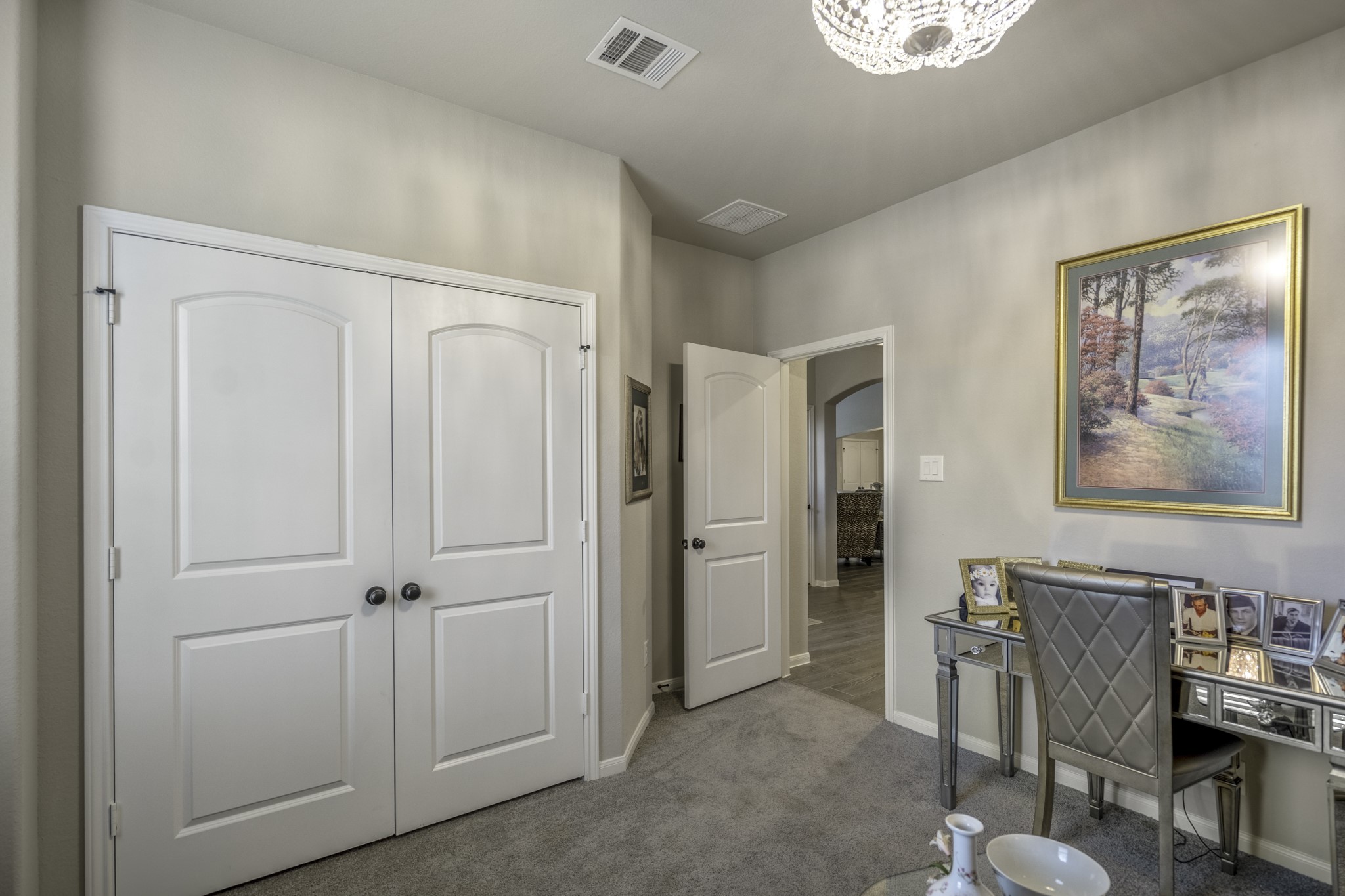 30391 Limber Pines Drive Magnolia, TX 77355 - Photo 15 of 49 Discover a cozy, inviting space off the front of the home, featuring elegant double doors, plush carpeting, and a shimmering chandelier that sets a warm tone for relaxation or productivity.