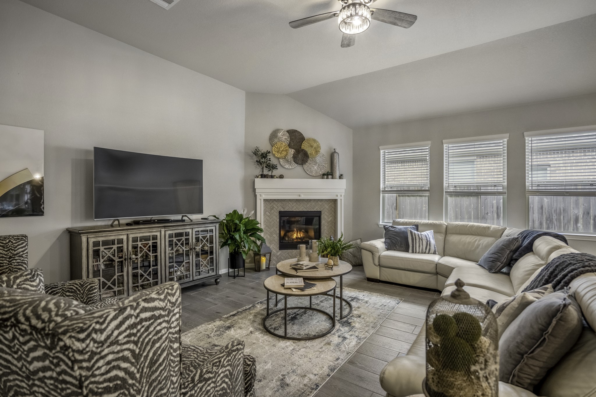 30391 Limber Pines Drive Magnolia, TX 77355 - Photo 19 of 49 Cozy up in this inviting living room, where a stunning fireplace warms the space on chilly nights, creating the perfect ambiance for relaxation.
