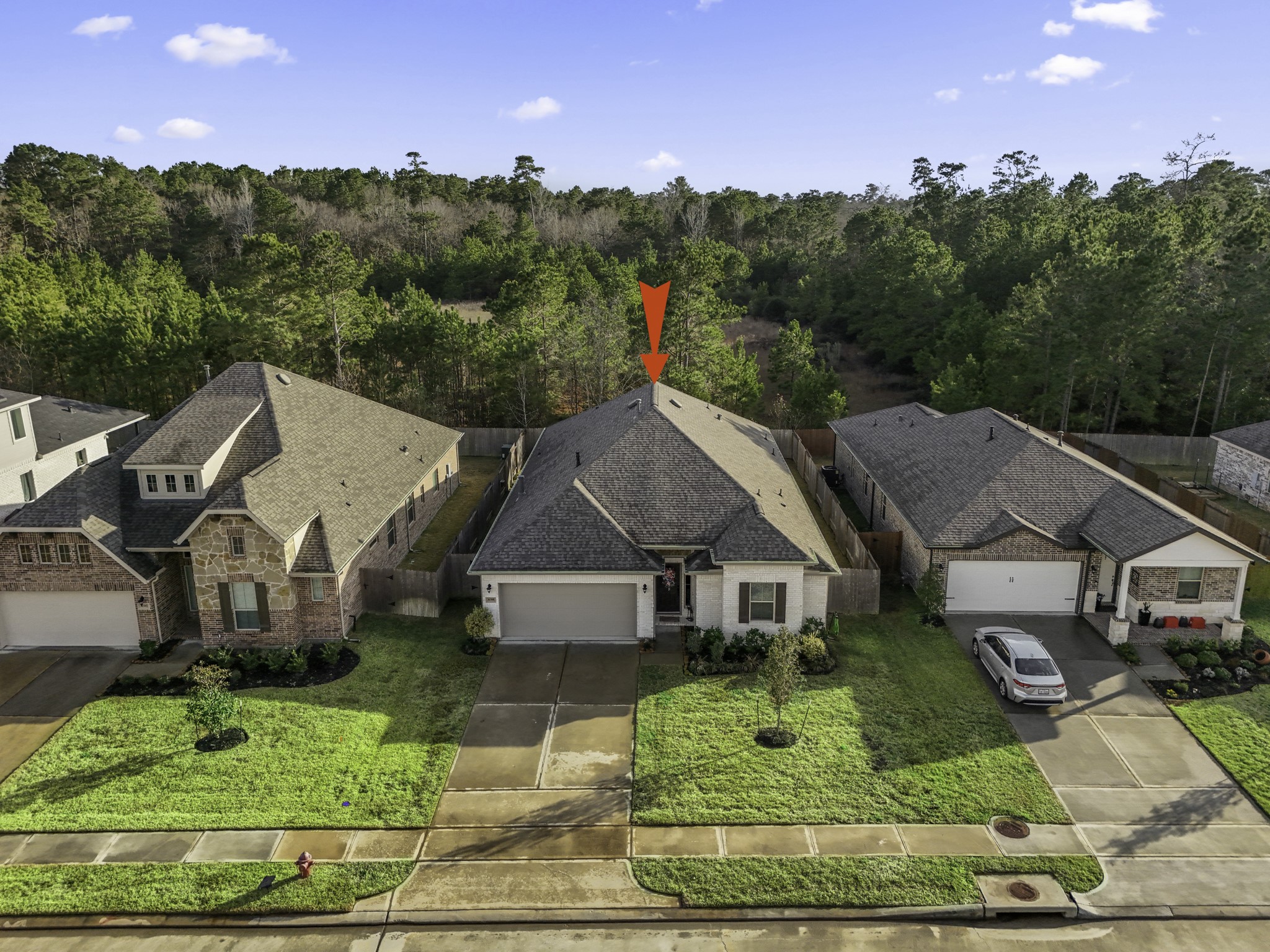 30391 Limber Pines Drive Magnolia, TX 77355 - Photo 2 of 49 Nestled in a serene neighborhood, this charming home boasts picturesque views of lush greenery from its spacious backyard, offering the perfect blend of comfort and tranquility.