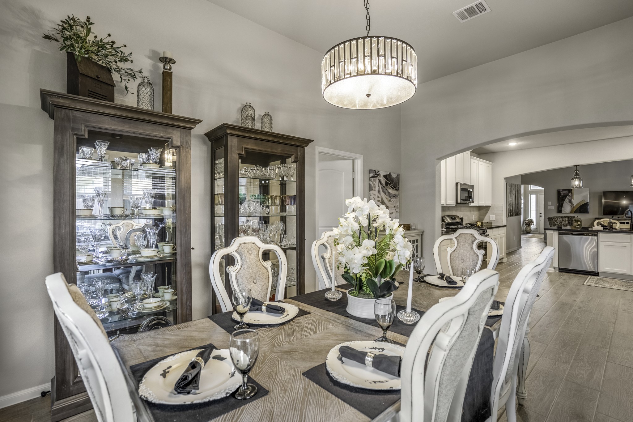 30391 Limber Pines Drive Magnolia, TX 77355 - Photo 27 of 49 Elevate your dining experience with a stunning modern chandelier that adds elegance and sophistication to this inviting space.