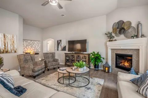 a living room with furniture and a fireplace