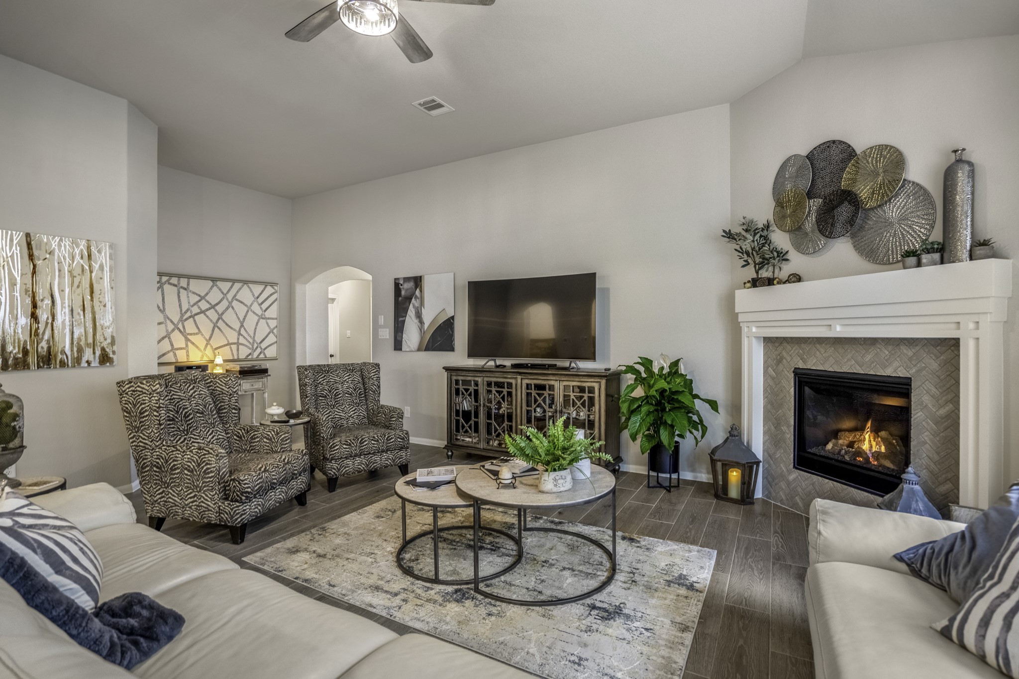 30391 Limber Pines Drive Magnolia, TX 77355 - Photo 3 of 49 This inviting living room, featuring a cozy fireplace and stylish decor, offers the perfect setting for entertaining guests in comfort and style.