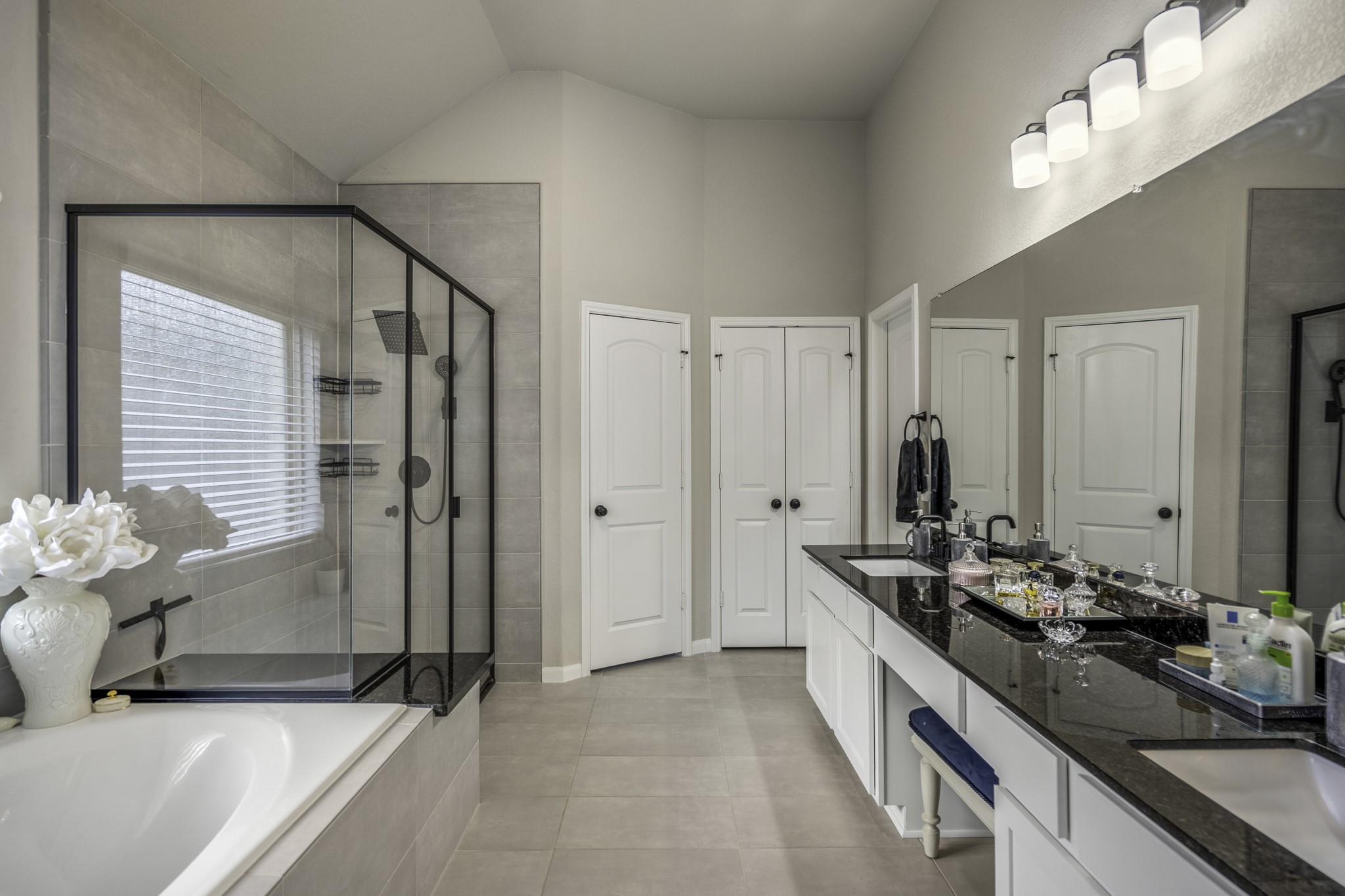 30391 Limber Pines Drive Magnolia, TX 77355 - Photo 31 of 49 Experience luxury in this primary ensuite, featuring sleek black finishes and a sophisticated design.