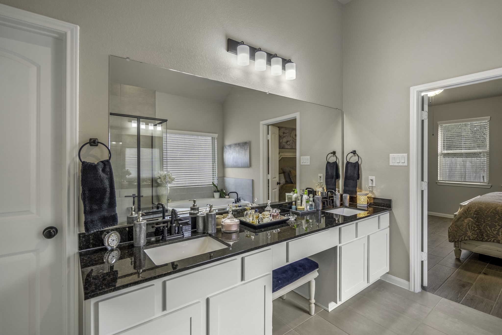 30391 Limber Pines Drive Magnolia, TX 77355 - Photo 34 of 49 Experience luxury in this elegant bathroom featuring a sleek double sink and spacious vanity area, perfect for modern living.