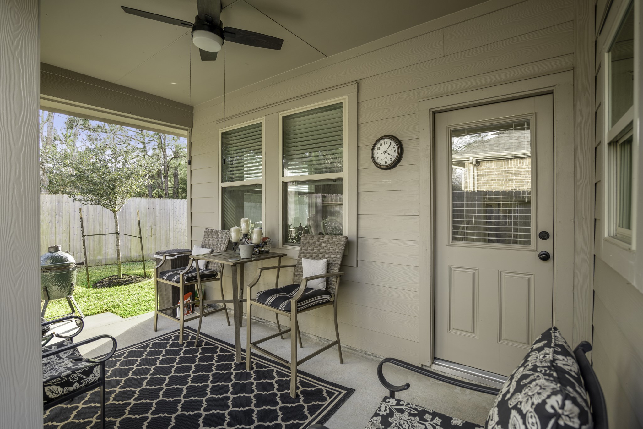 30391 Limber Pines Drive Magnolia, TX 77355 - Photo 38 of 49 Enjoy a refreshing outdoor retreat on this cozy patio, complete with a ceiling fan to keep you cool during those warm Texas days!
