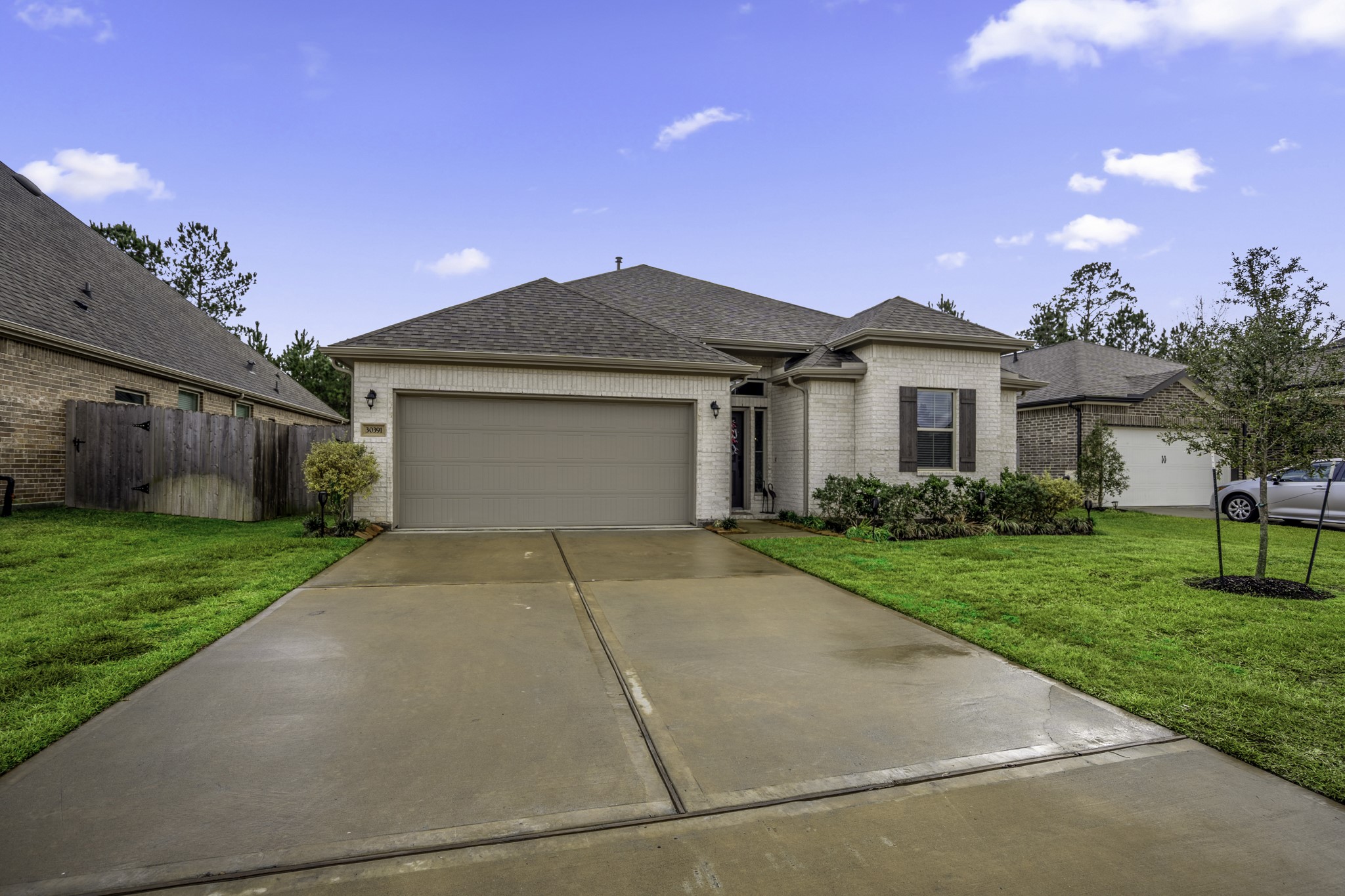30391 Limber Pines Drive Magnolia, TX 77355 - Photo 49 of 49 Discover a home with beautiful curb appeal, featuring a neat driveway, charming façade, and well-maintained landscaping, perfect for creating lasting first impressions.