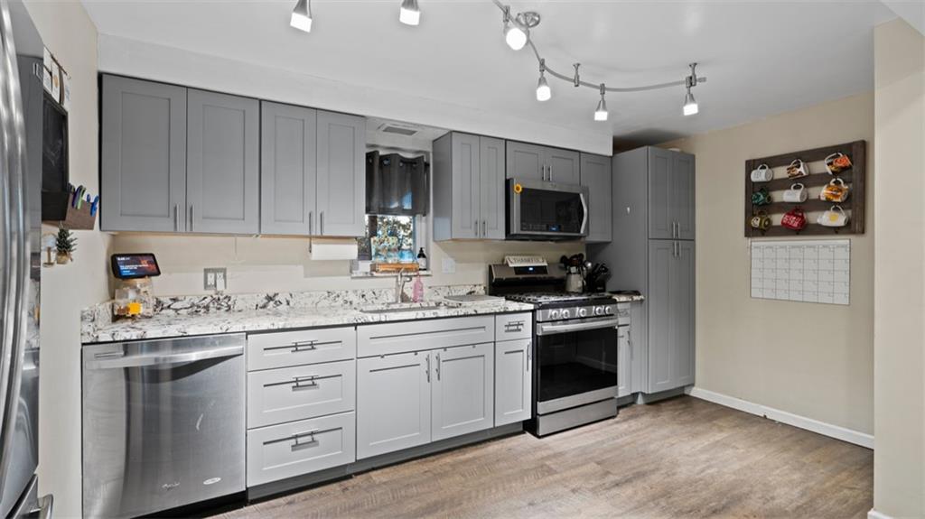 300 Sunset Boulevard Washington, PA 15301 - Photo 11 of 38 a kitchen with a sink stove and microwave