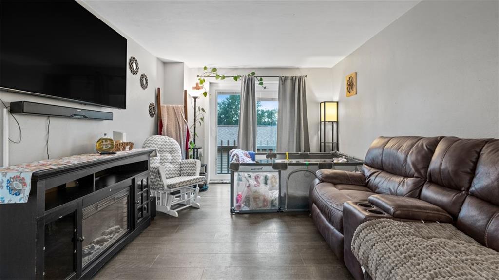 300 Sunset Boulevard Washington, PA 15301 - Photo 17 of 38 a living room with furniture and a flat screen tv