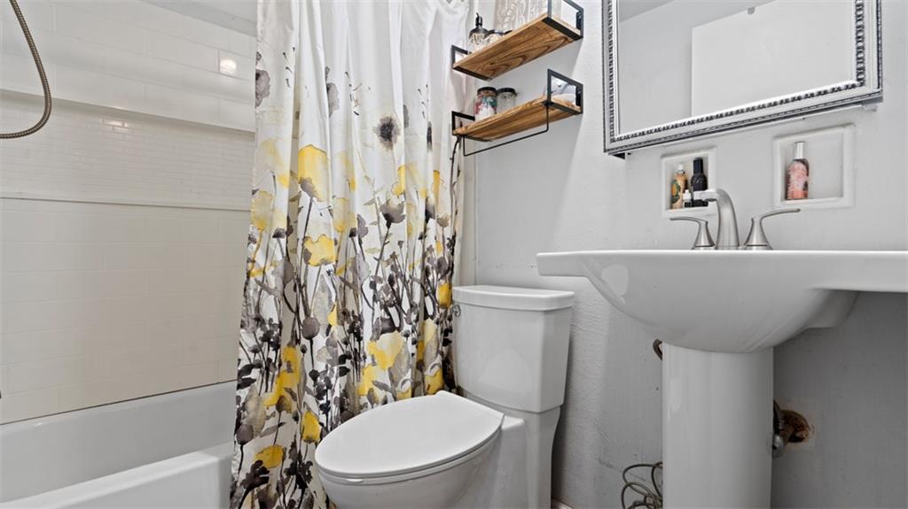 300 Sunset Boulevard Washington, PA 15301 - Photo 19 of 38 a white toilet sitting next to a bathroom sink