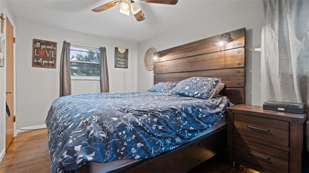 300 Sunset Boulevard Washington, PA 15301 - Photo 20 of 38 a bedroom with a large bed and a chandelier