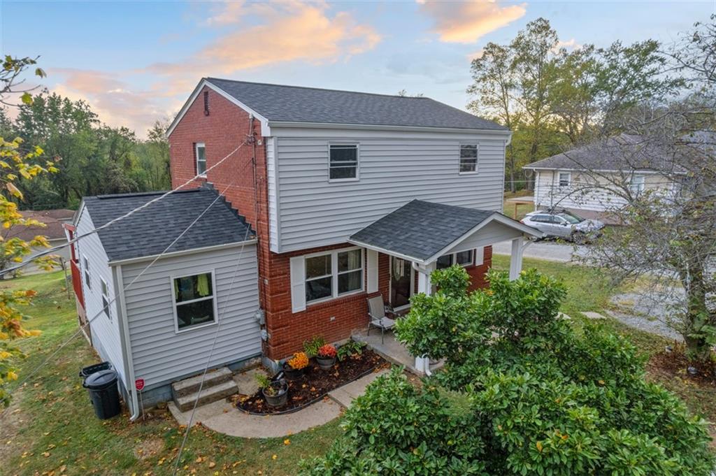 300 Sunset Boulevard Washington, PA 15301 - Photo 2 of 38 a aerial view of a house with table and chairs under an umbrella