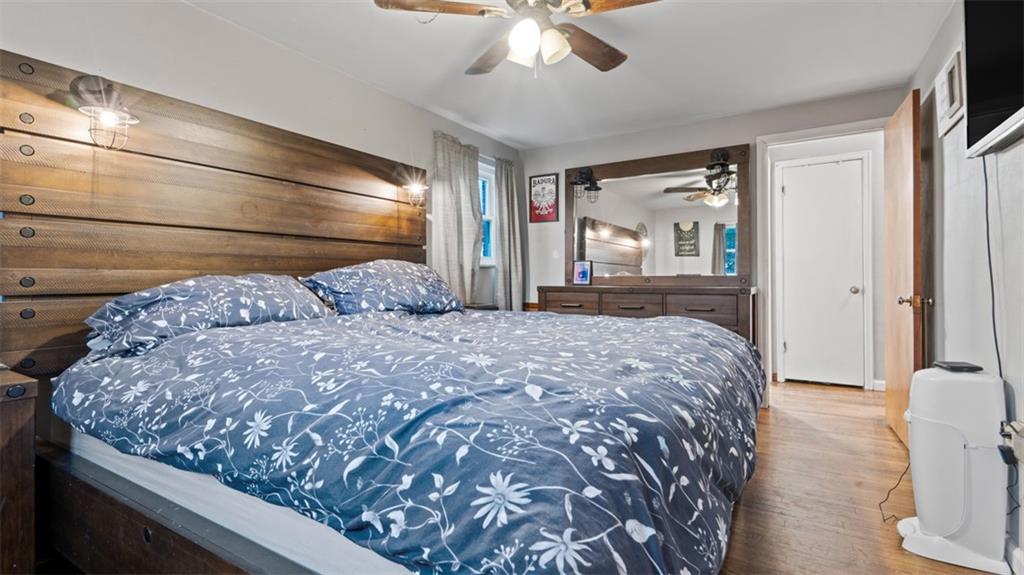 300 Sunset Boulevard Washington, PA 15301 - Photo 21 of 38 a bedroom with a large bed and a chandelier