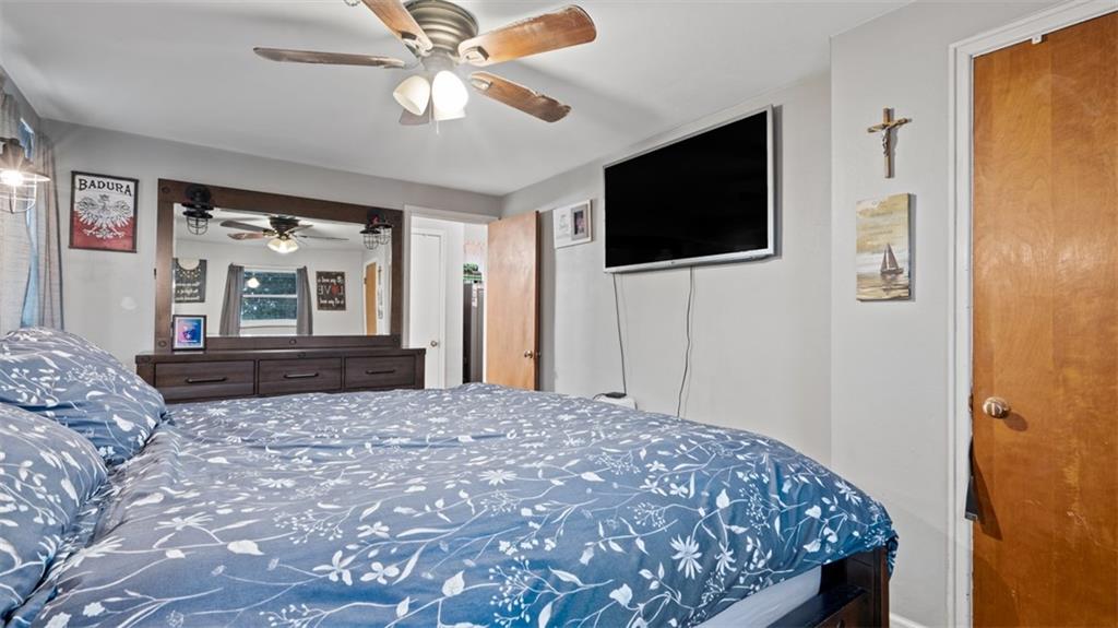 300 Sunset Boulevard Washington, PA 15301 - Photo 22 of 38 a bedroom with a bed and a flat screen tv