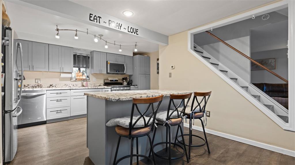300 Sunset Boulevard Washington, PA 15301 - Photo 8 of 38 a kitchen with a table chairs microwave and cabinets