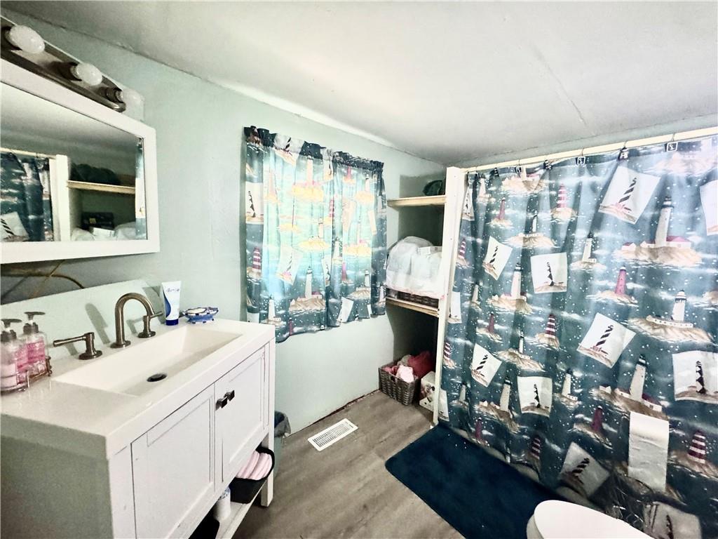 21 South Round Street New Castle, PA 16101 - Photo 6 of 6 a living room with furniture and a large window