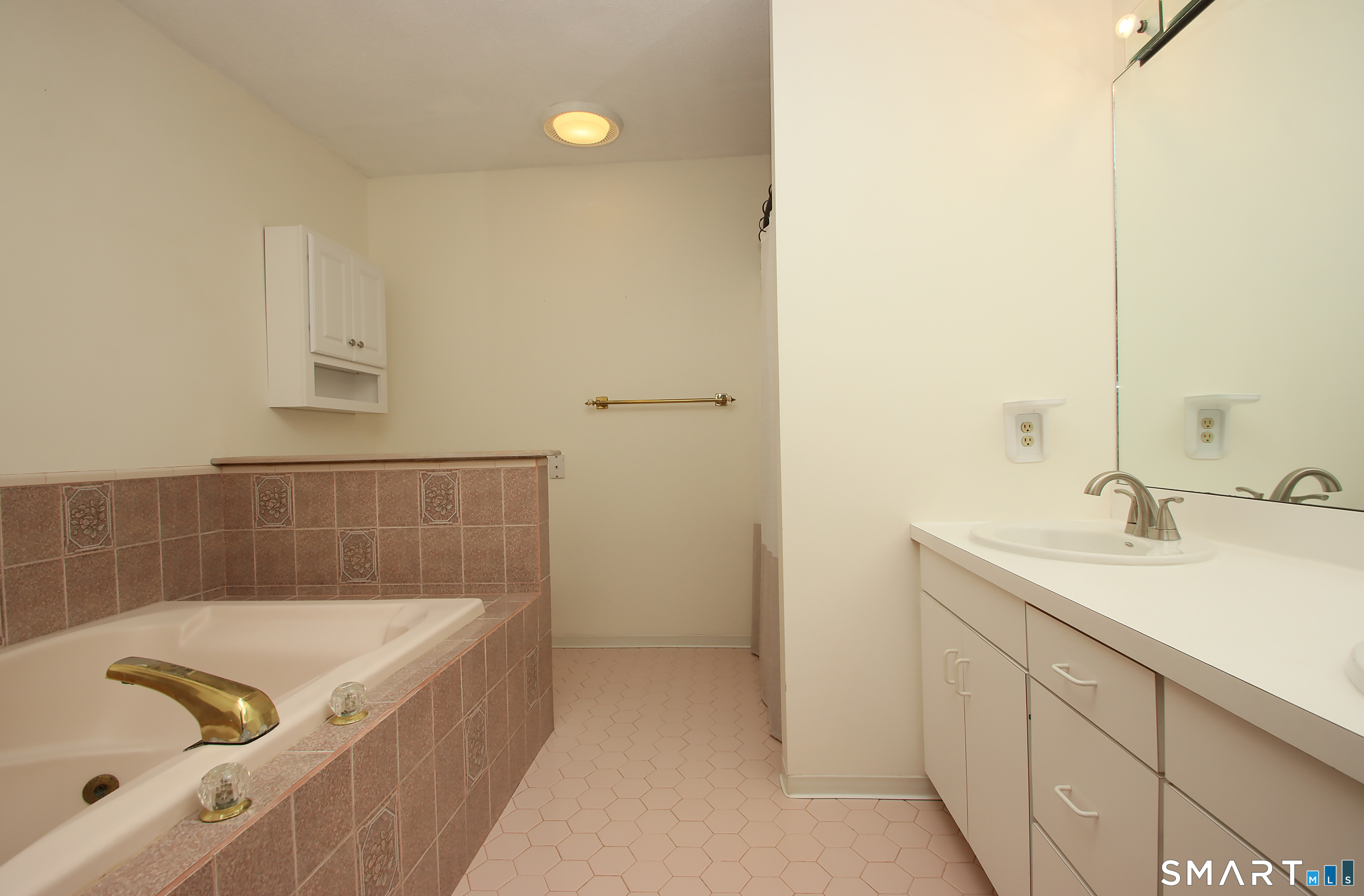 352 Center Street Wolcott, CT 06716 - Photo 23 of 40 a bathroom with a tub sink and mirror