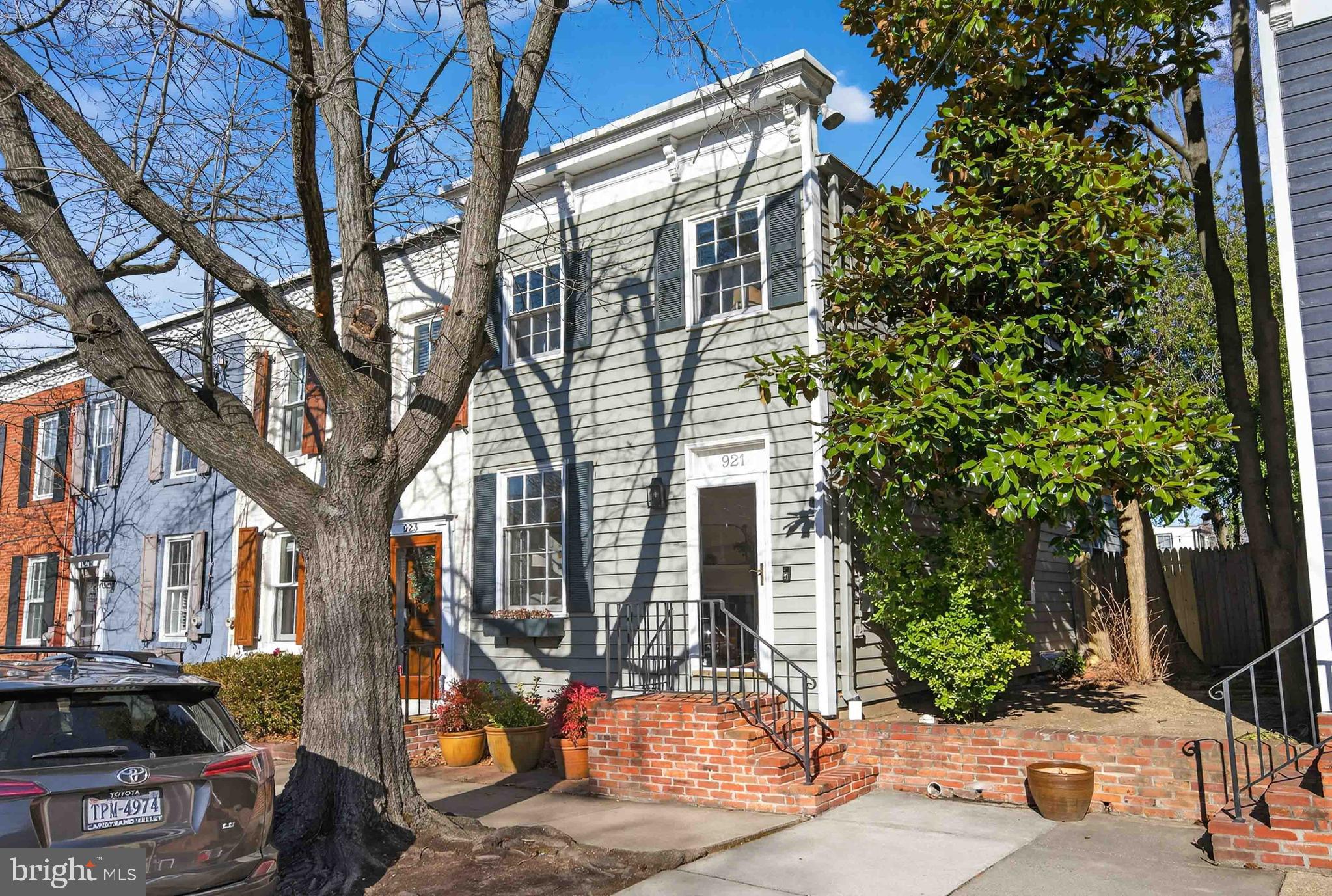 a front view of a house with tree s