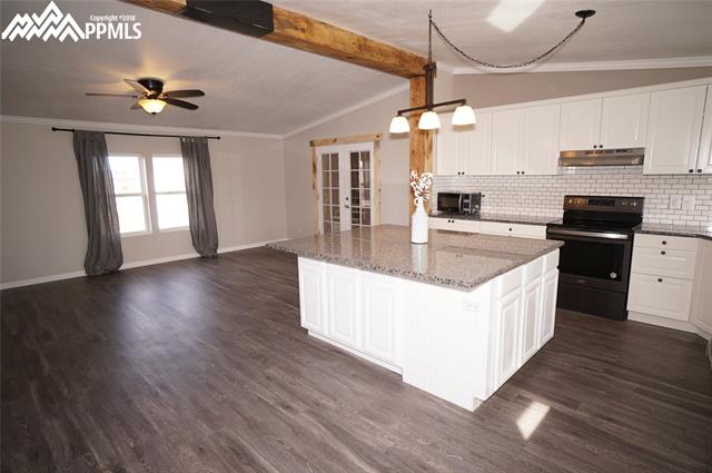 13745 Woodlake Road Elbert, CO 80106 - Photo 2 of 36 Kitchen island/dining room