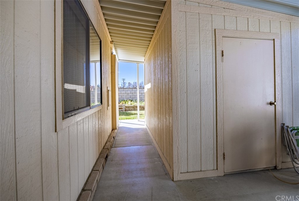 24600 Mountain Avenue, Unit 57 Hemet, CA 92544 - Photo 19 of 20 a view of a hallway with wooden floor and entryway