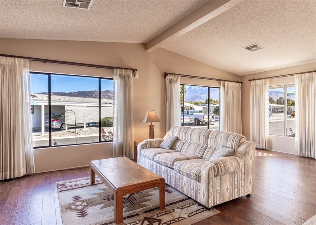 24600 Mountain Avenue, Unit 57 Hemet, CA 92544 - Photo 4 of 20 a living room with furniture and a window